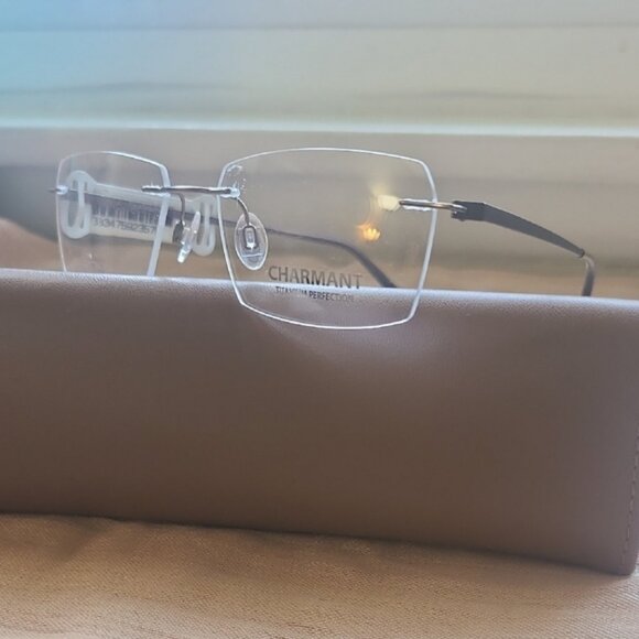 NEW & AUTHENTIC FRAME CHARMANT MODEL CH10973, SIZE 54-18-145, COLOR-95, TITANIUM - Picture 1 of 3